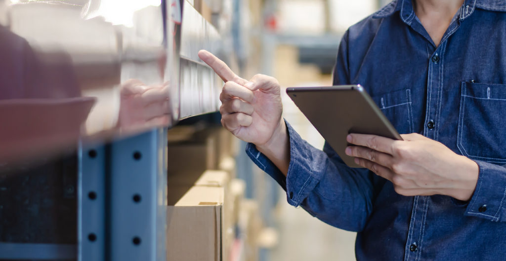 Close-up of employee performing a cycle count.